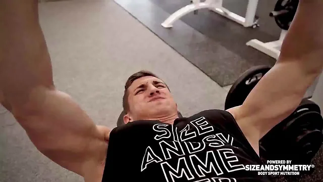 Hot bodybuilder flexing his muscles