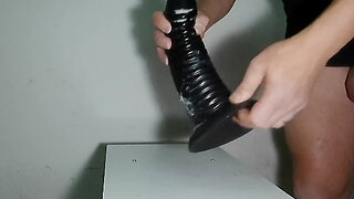 Inserting huge plugs and dildos in the butt
