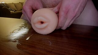 Mouth and backside dildo fuck and jizz out of mouth