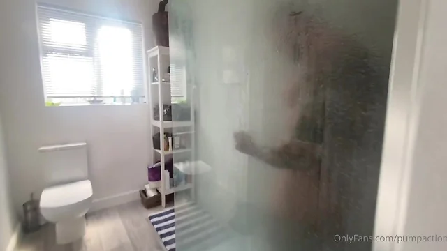 Athletic man showering: clockstopping moment