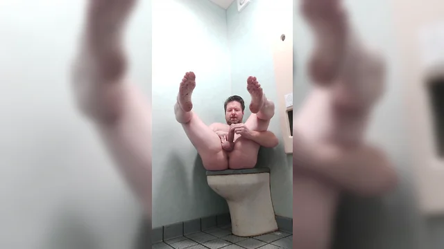 Masturbating exposed in a public restroom
