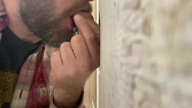 Sucking a thrilled man at a glory hole - full video