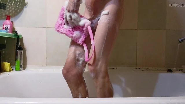 Sissy bathing in foam reveals ass and genitals