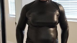 Maddy tries on black leather dress