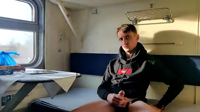 Masturbating in a train cabin while wearing hoodie and shorts