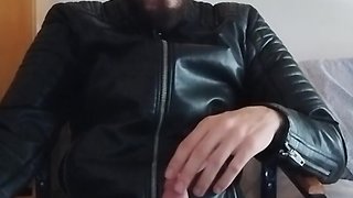 Leather-clad men smoking and masturbating