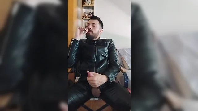 Leather-clad men smoking and masturbating