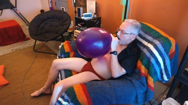 Popping daddy balloonbangers inflated large round balloon