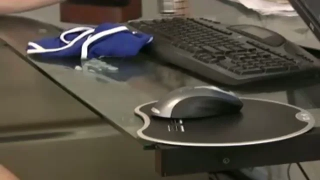 Dude bursts up on his desk