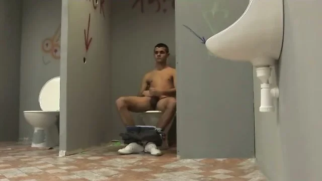 Twink fondles cock in bathroom