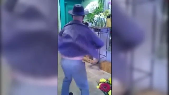 Nasty mature man dances in a flowershop